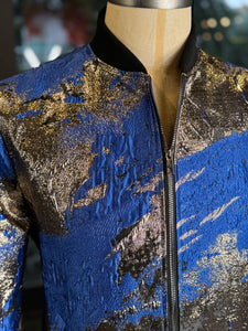 Bomber azul manchas oro
