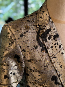 Saco dorado manchas